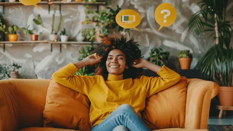 A woman smiling on a couch pondering ideas, featuring a furniture style quiz theme.