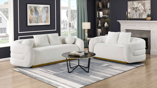 Novella white sherpa sofa with gold base styled in a bright living room