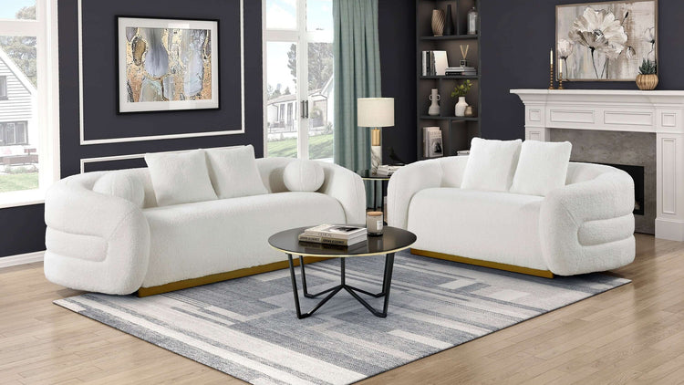 Novella white sherpa sofa with gold base styled in a bright living room
