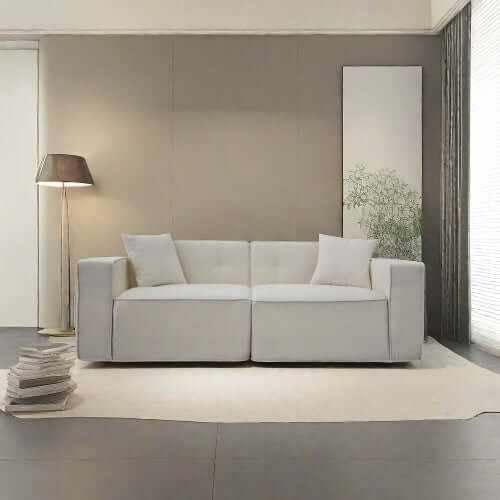 Modern low profile box arm memory foam sofa in white, featuring plush cushions, set in a stylish living room.