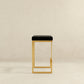 Joel Gold Velvet Bar Stool – Upholstered Backless Counter Stool with Metal Frame (Modern Glam Style) on a neutral background.