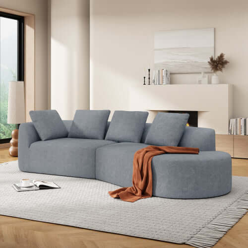 Modern Low Profile Modular Curved Foam Sofa 116' (4 Colors) in a stylish living room setting with cozy cushions.