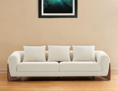 100" Cream Fabric Sofa with Brown Wood Legs & Rounded Arms, featuring soft cushions and a modern design.
