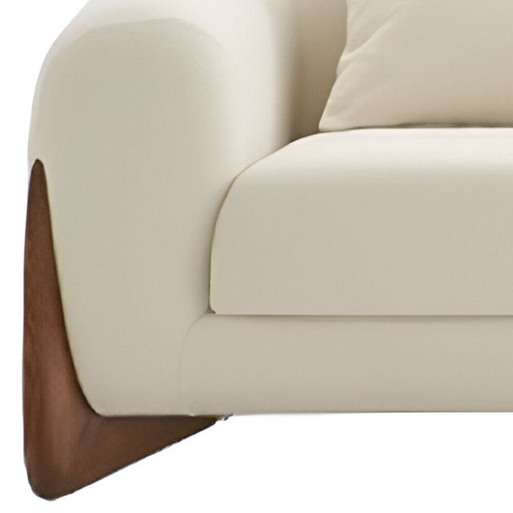 100" Cream Fabric Sofa with Brown Wood Legs & Rounded Arms detail showing soft cream upholstery and warm brown wood accents.