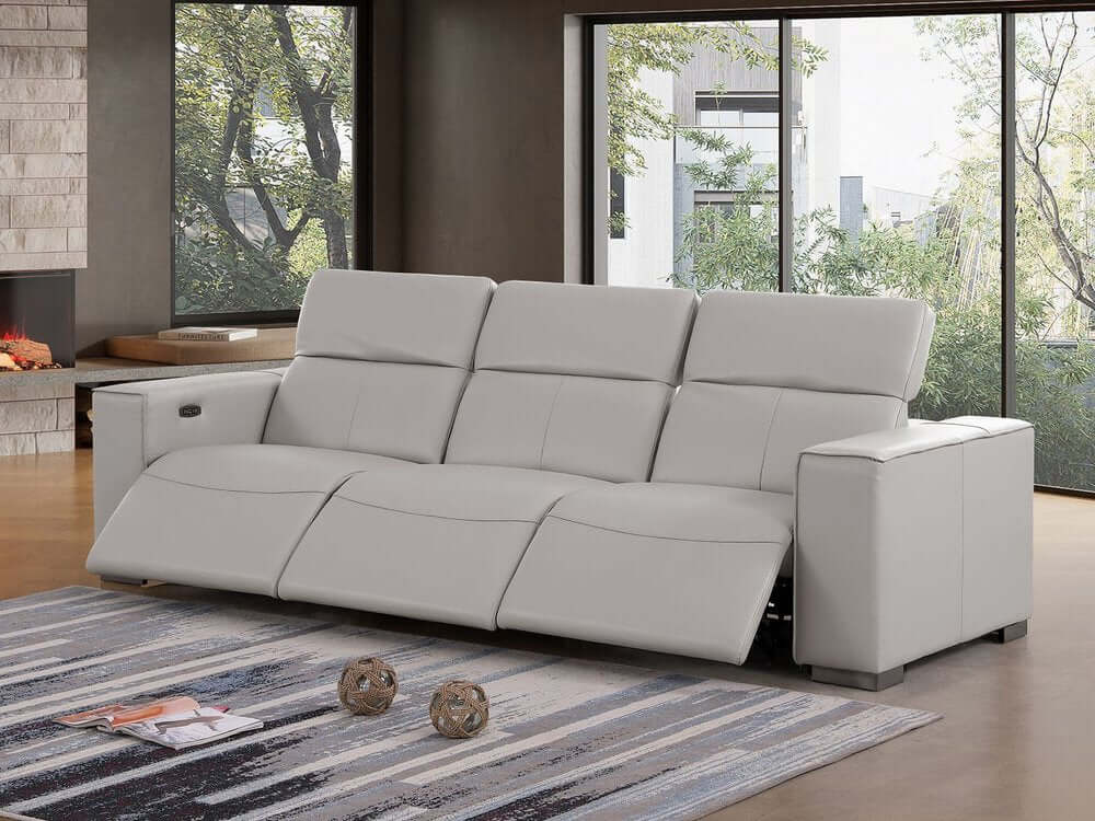 110" Top Grain Leather Power Reclining Sofa with USB Ports (3 Colors) in light gray on a stylish rug.