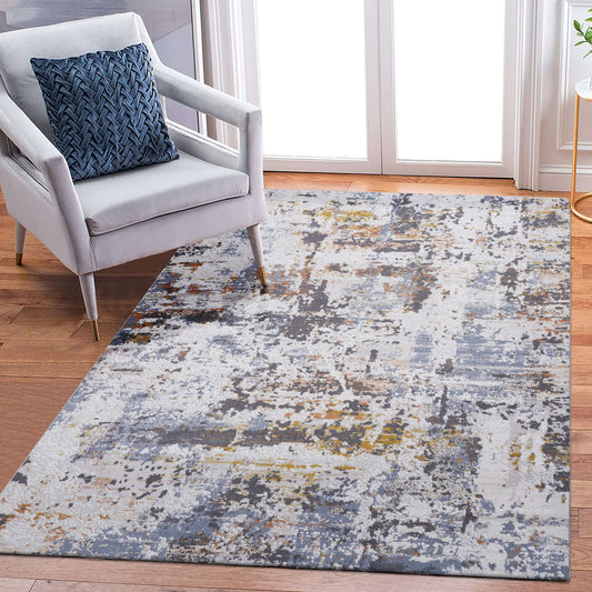 Multicolor abstract area accent rug 5x7ft in living room with chair and pillow, enhancing modern decor.