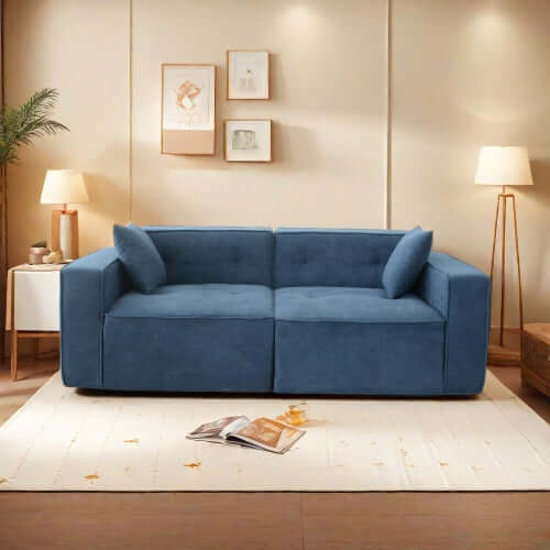 Modern low profile blue memory foam sofa in stylish living room setting with decorative pillows.