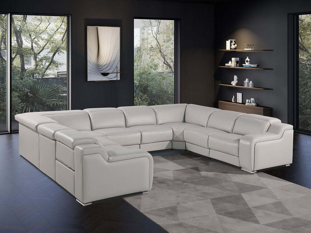 Light Gray Italian Leather Power Reclining U Shaped Eight Piece Corner Sectional With Console in modern living space.
