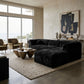 Sutter Faux Fur Corner Wedge Pair styled in a contemporary living room