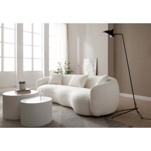 Modern Boucle Curved Sofa 94" – Sculptural 3-Seater Upholstered Couch (4 Colors) in a cozy living room setting.