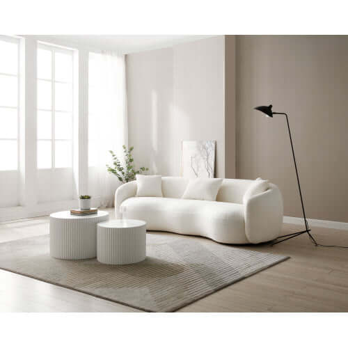 Modern Boucle Curved Sofa 94" – Sculptural 3-Seater Upholstered Couch (4 Colors) in a stylish living room setting.