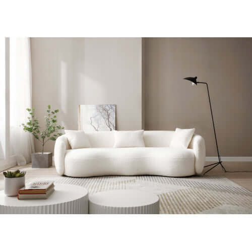 Modern Boucle Curved Sofa 94" – Sculptural 3-Seater Upholstered Couch (4 Colors) in a cozy living room setting.