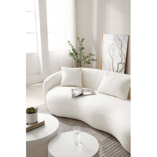 Modern Boucle Curved Sofa 94" – Sculptural 3-Seater Upholstered Couch (4 Colors) in bright, modern living room setting.