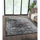 Distressed vintage Persian styled woven area rug in a modern living room setting, 8x10ft, showcasing timeless elegance.