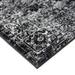 Close-up of distressed vintage Persian styled woven area rug showcasing intricate pattern and texture.