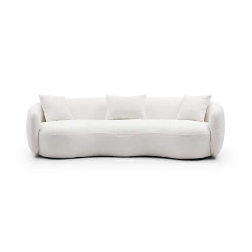 Modern Boucle Curved Sofa 94" – Sculptural 3-Seater Upholstered Couch (4 Colors) in white upholstery with plush pillows.