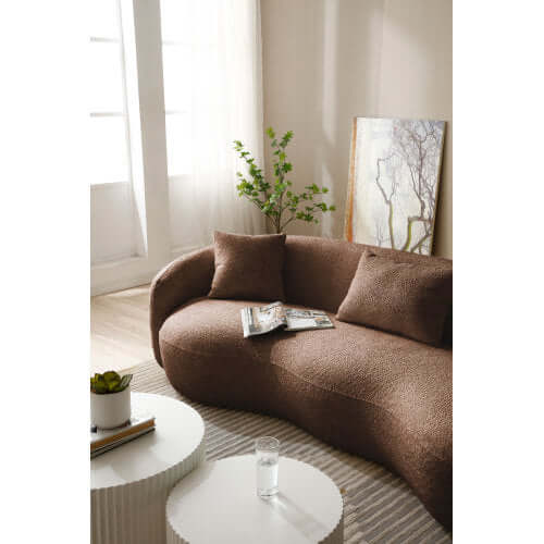 Modern Boucle Curved Sofa 94" – Sculptural 3-Seater Upholstered Couch (4 Colors) in a cozy living room setting.