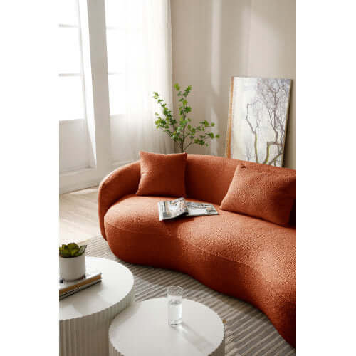 Modern Boucle Curved Sofa 94" – Sculptural 3-Seater Upholstered Couch (4 Colors) in a cozy living room setting.