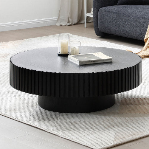 Contemporary Round Coffee Table 39" – Modern MDF Pedestal Coffee Table (3 Colors) standing in a modern living room setting.