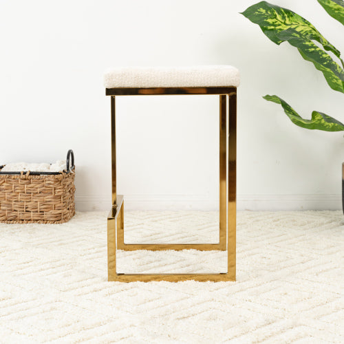 Joel Gold Velvet Bar Stool – Upholstered Backless Counter Stool with Metal Frame (Modern Glam Style) on a textured rug.