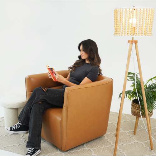 Tan Faux Leather Swivel Chair – Modern Barrel Accent Chair with 360° Swivel (Fully Assembled) in a cozy living space.