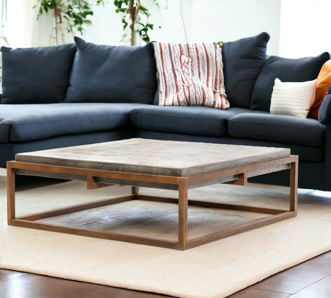 Square Concrete Coffee Table 44" – Industrial Metal Frame Coffee Table in modern living room setting with dark couch.