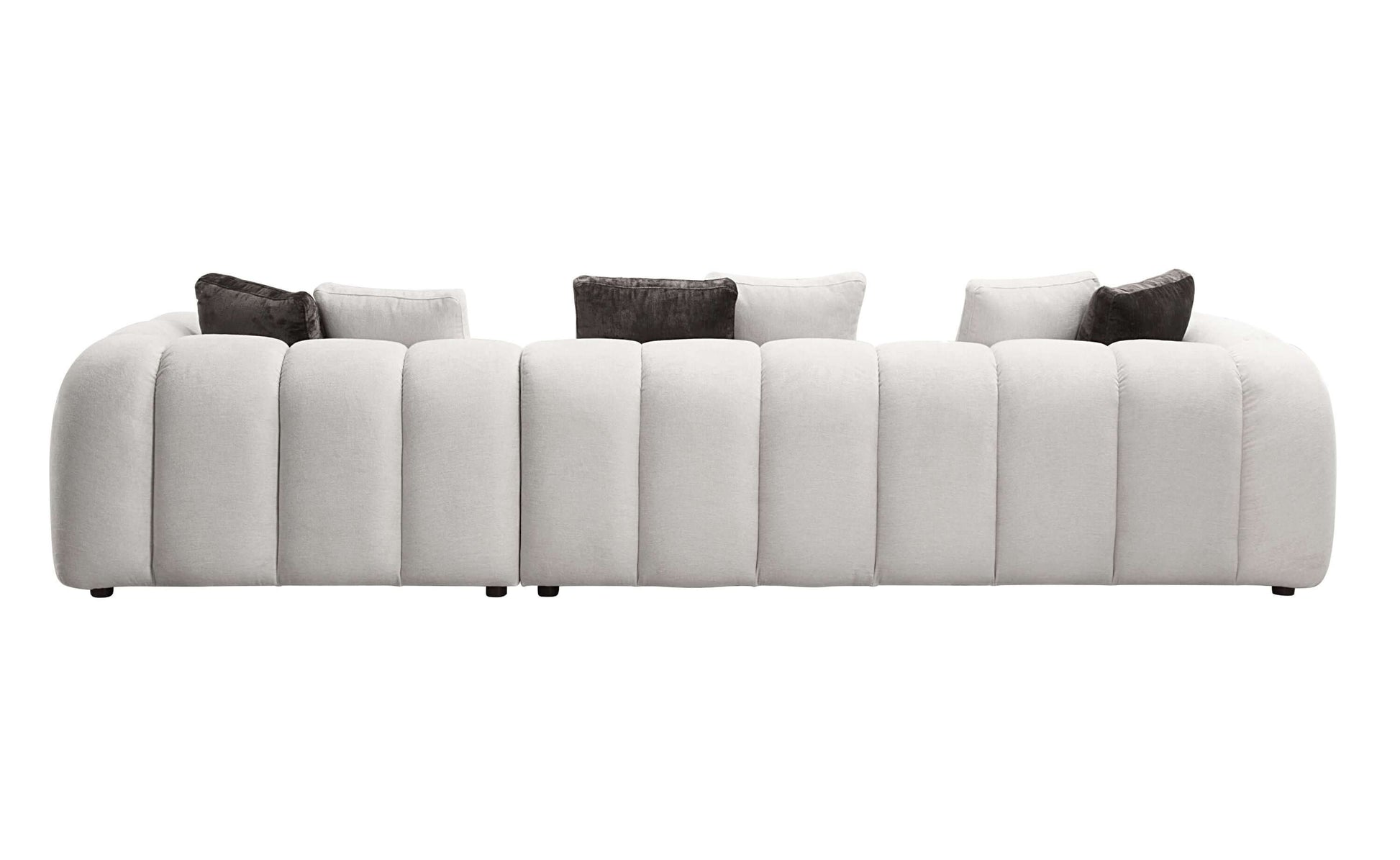 White sectional sofa featuring a modern design with plush cushions and 8 decorative pillows for comfort and style.