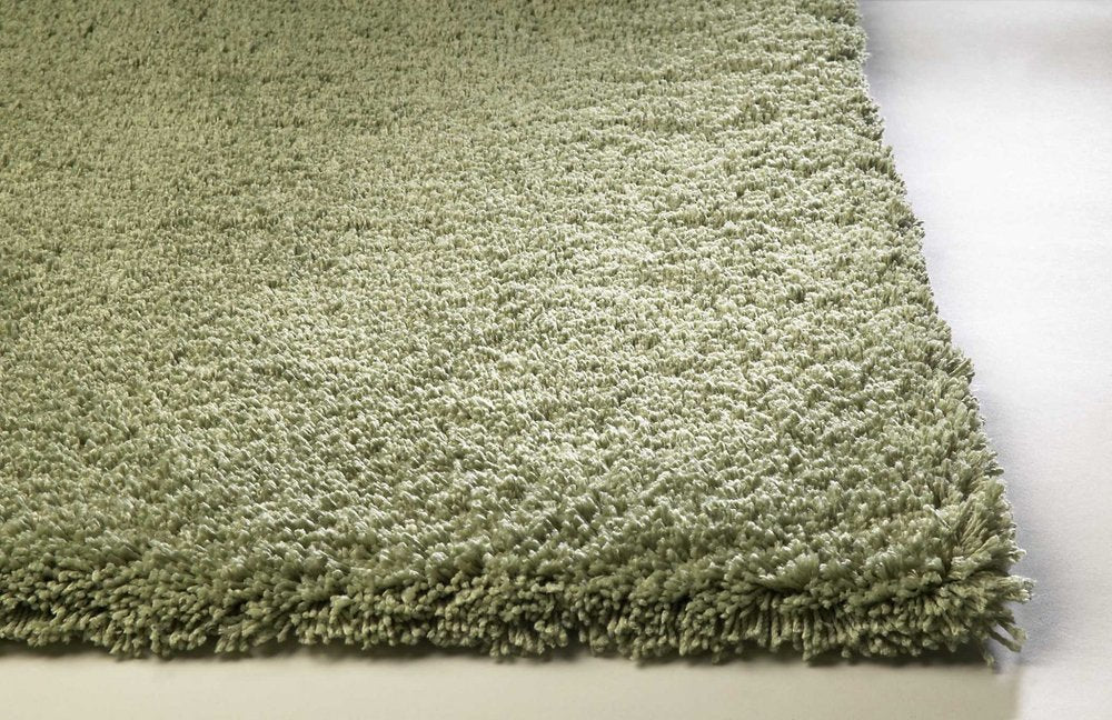 Sage Hand Woven Area Rug | 9' x 13'. Soft, textured green fibers highlighting the modern design and cozy feel.