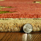 Sienna Gold And Green Wool Floral Vines Hand Tufted Area Rug | 9' x 13' showing texture and thickness next to a quarter for scale.