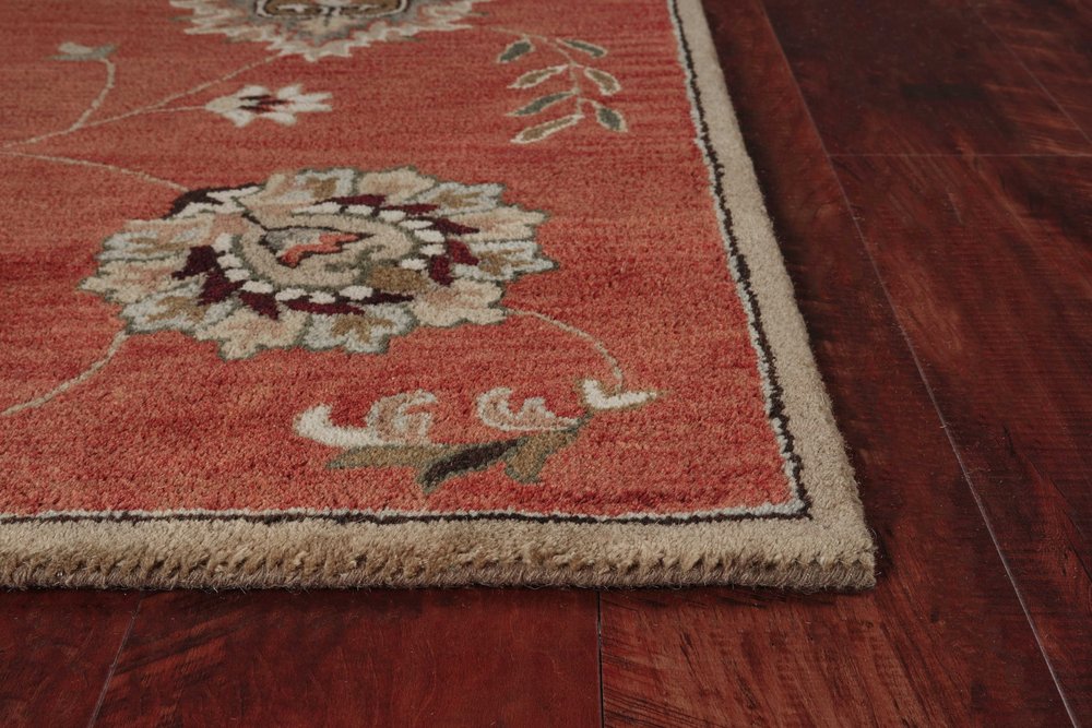 Sienna Gold And Green Wool Floral Vines Hand Tufted Area Rug | 9' x 13' close-up on floral detail and edge.