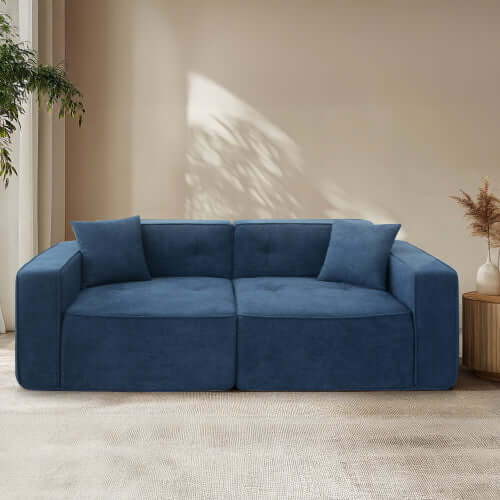 Modern low profile box arm memory foam sofa in deep blue, offering plush comfort and stylish design for any living room.