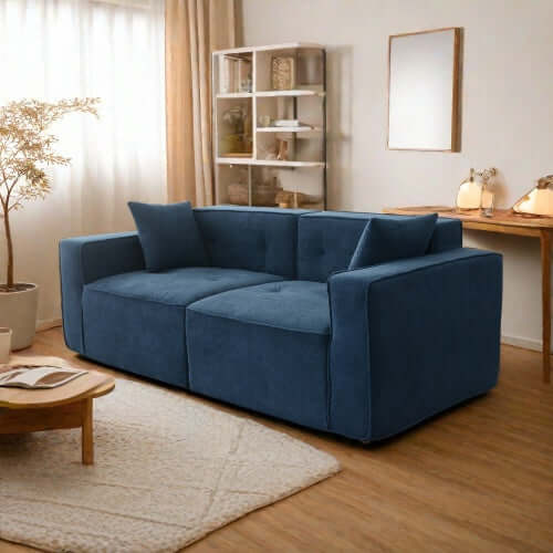 Modern low profile box arm memory foam sofa in blue, stylish design for ultimate comfort in living room.