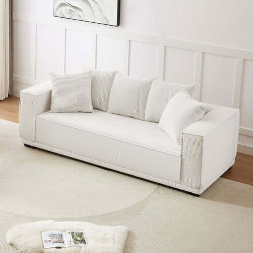 MCM Box Arm Corduroy Upholstered Sofa 89" in white with plush pillows, showcasing mid-century design and cozy comfort.