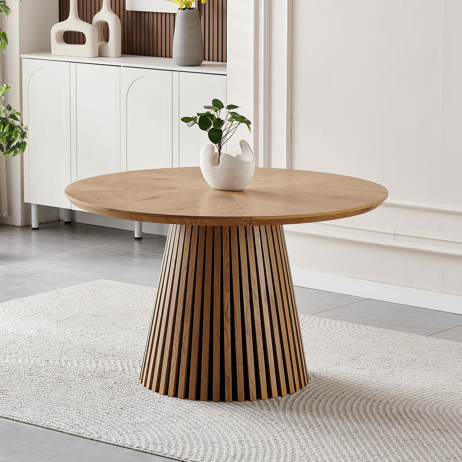 47-Inch Modern Round Dining Table for 4 with slatted base and natural wood finish in stylish dining area.