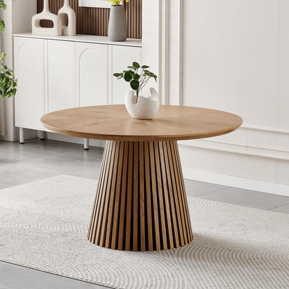 47-Inch Modern Round Dining Table for 4 with slatted base and natural wood finish in stylish dining area.