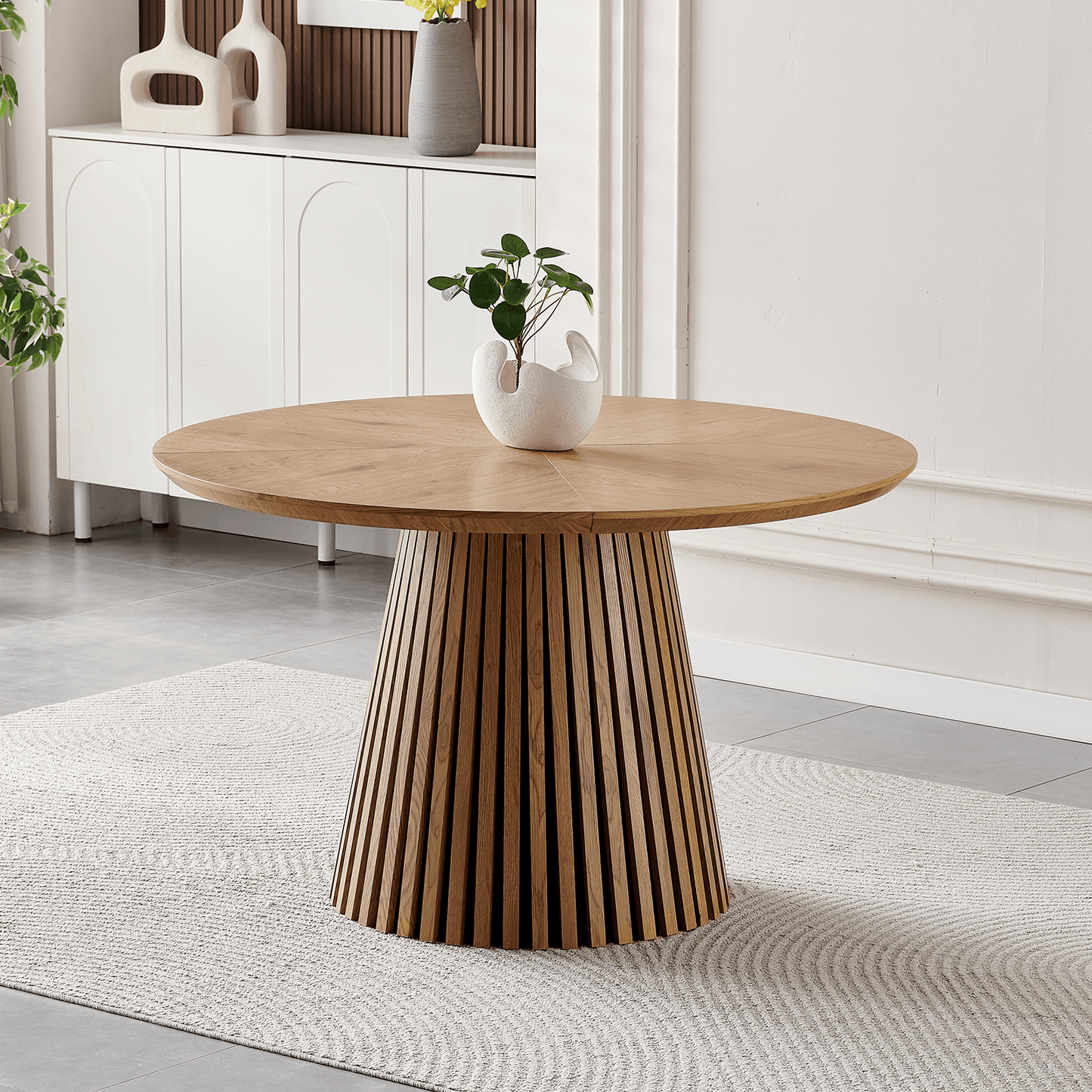 47-Inch Modern Round Dining Table for 4 with slatted base and natural wood finish in stylish dining area.
