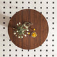 47-Inch Round Walnut Dining Table for 4 – Modern Farmhouse Kitchen Table with Wood Strip Base, overhead view with flowers and fruit.