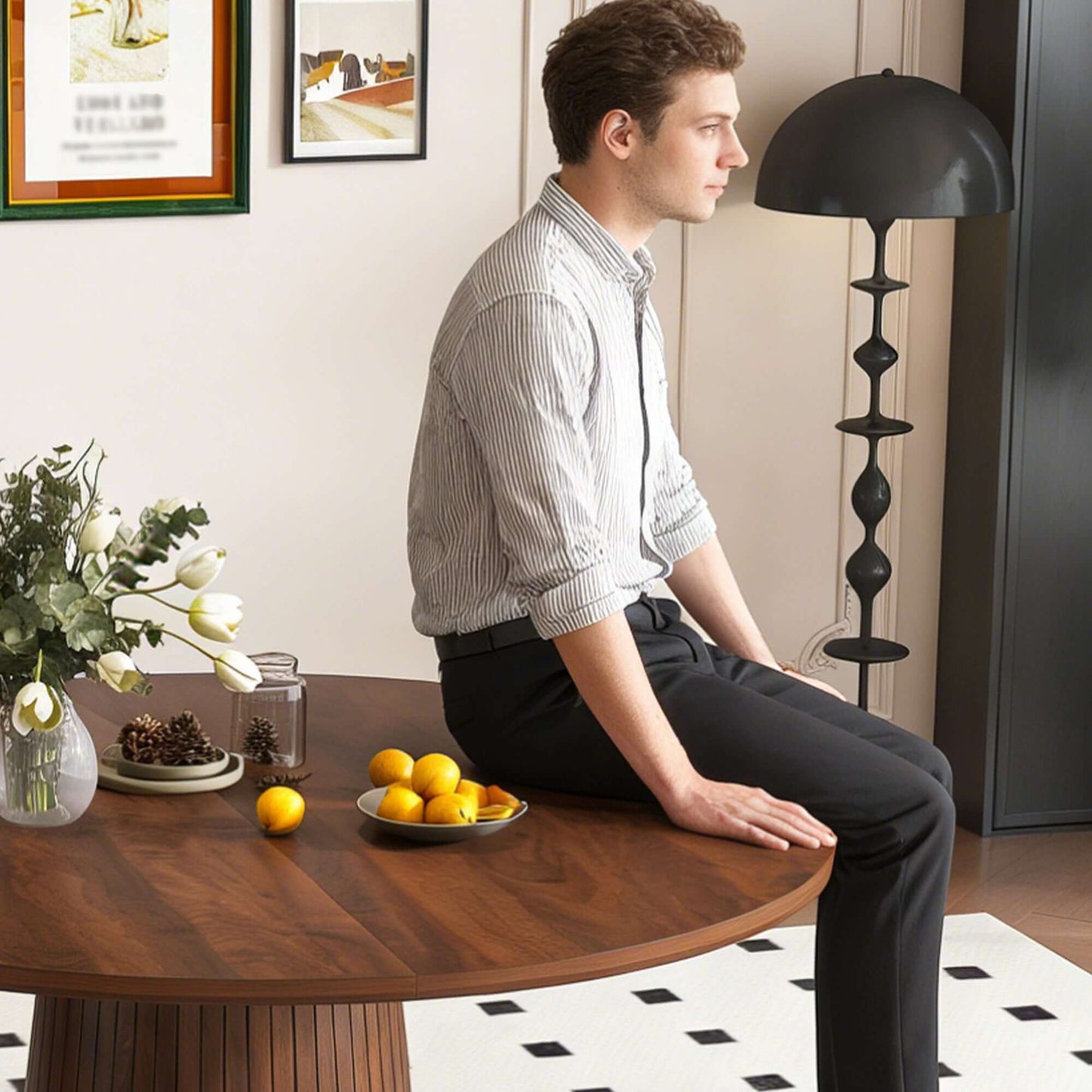 47-Inch Round Walnut Dining Table for 4 – Modern Farmhouse Kitchen Table with Wood Strip Base, man sitting at stylish table.