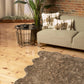 Cozy living room featuring a scalloped faux fur shag rug and modern decor for elegant comfort.