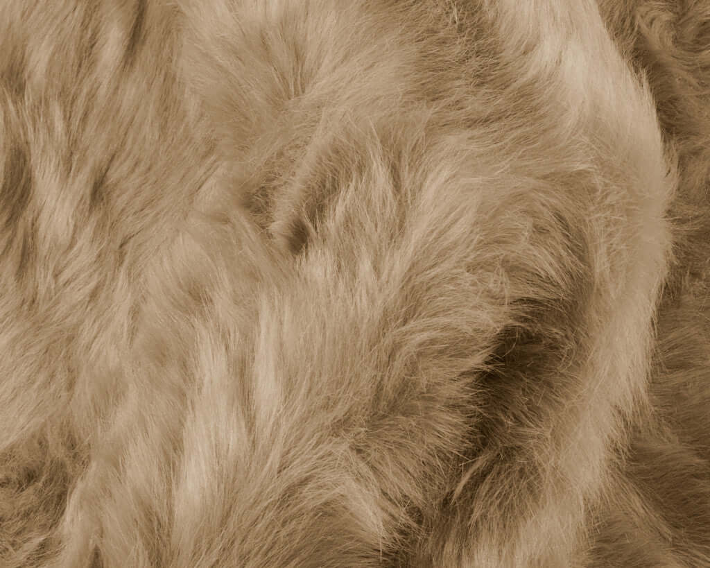 Close-up of soft beige faux fur texture, perfect for adding warmth to any modern decor.
