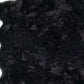 Black scalloped faux fur shag rug, 6' x 6', featuring a soft and luxurious texture for modern spaces.
