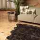 Scalloped faux fur shag rug in a modern living room setting, showcasing cozy elegance and stylish decor.