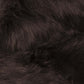 Close-up of soft, luxurious dark faux fur, showcasing the plush texture of a sleek shag rug.