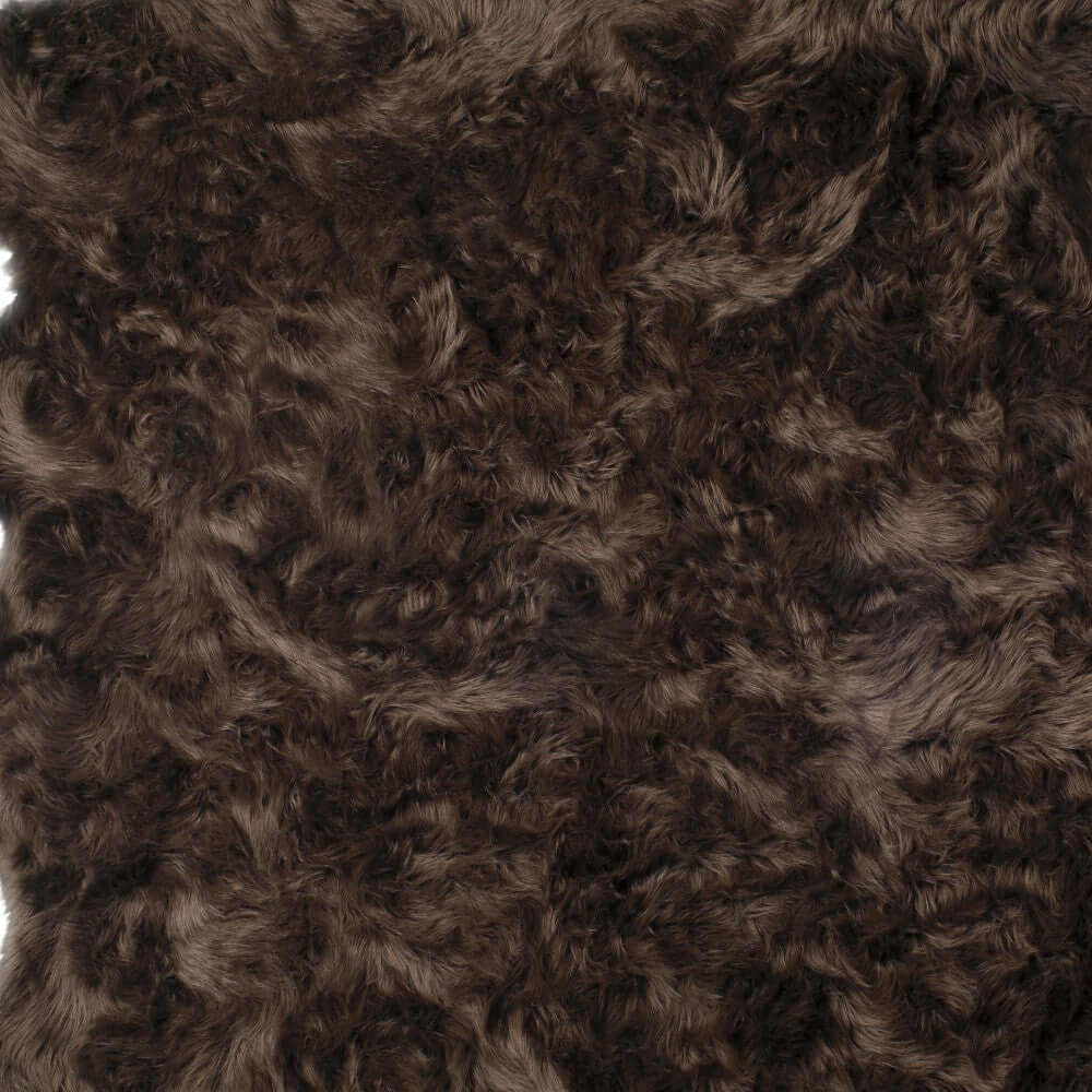 Soft brown shag rug close-up, featuring luxurious faux fur texture, ideal for modern home decor.