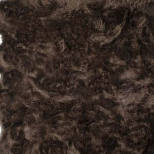 Close-up of luxurious brown scalloped faux fur area shag rug, 100% animal-free acrylic plush.