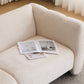 Tonson Boucle Sofa – 83” Curved Wave 3-Seater Sofa (3 Colors, Modern Sculptural Design) with magazines on it.