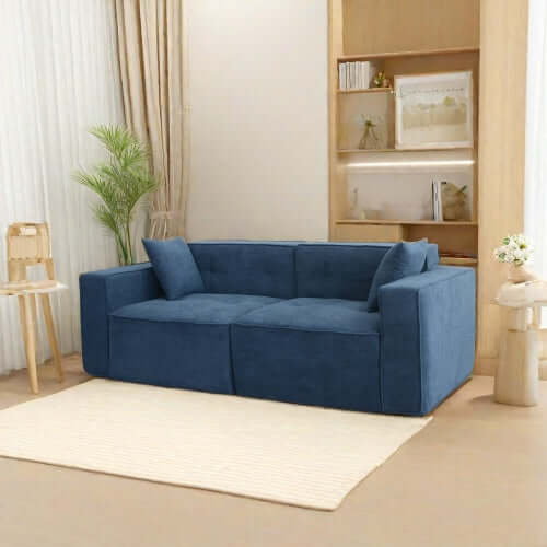 Modern low profile box arm memory foam sofa in blue, offering stylish comfort for any living room.
