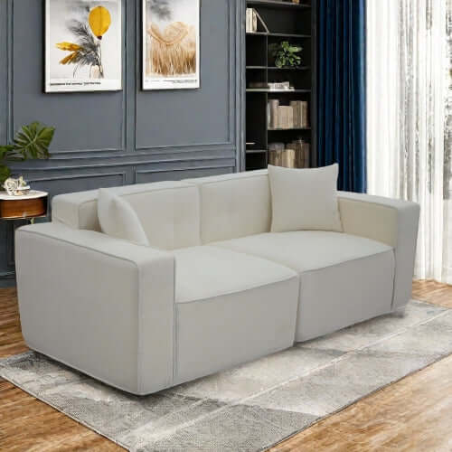 Modern low profile box arm memory foam sofa in light gray, featuring sleek design and ergonomic comfort.