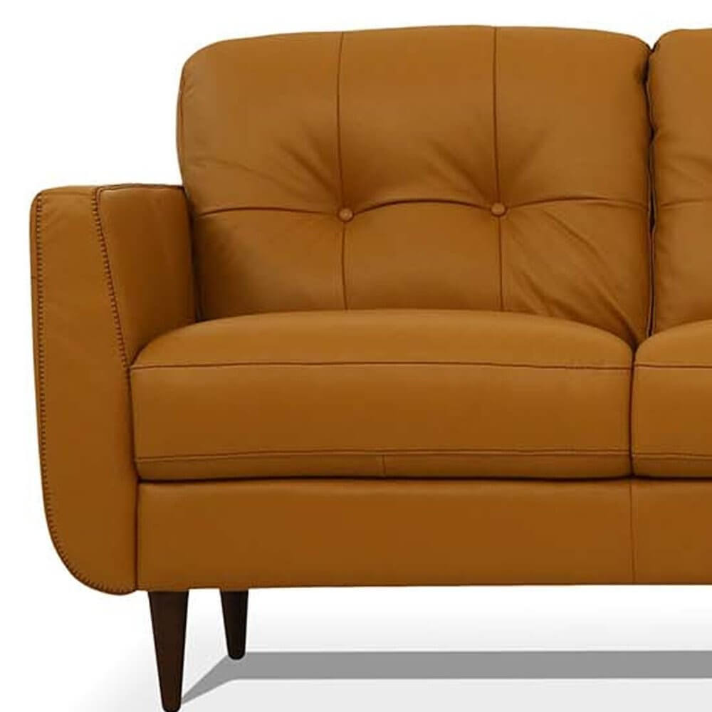 83" Orange Leather Sofa With Black Legs showcasing its buttery soft leather and stylish design.