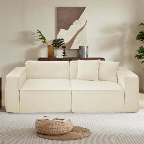 Modern low profile box arm memory foam sofa in cream, featuring plush pillows and stylish decor.